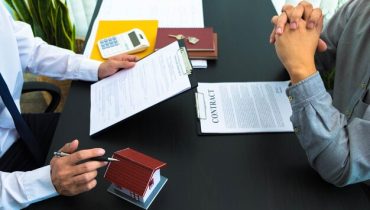 midsection-man-reading-book-table_1048944-29925985